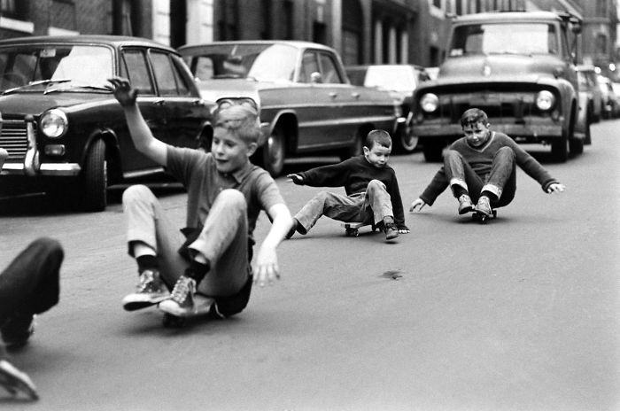 Boys Skateboarding In Streets Of New York, 1960s, in between cars and traffic having fun