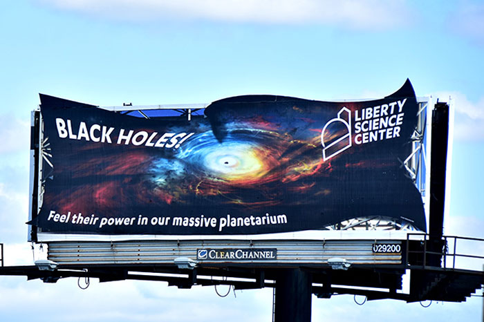 Liberty Science black holes billboard