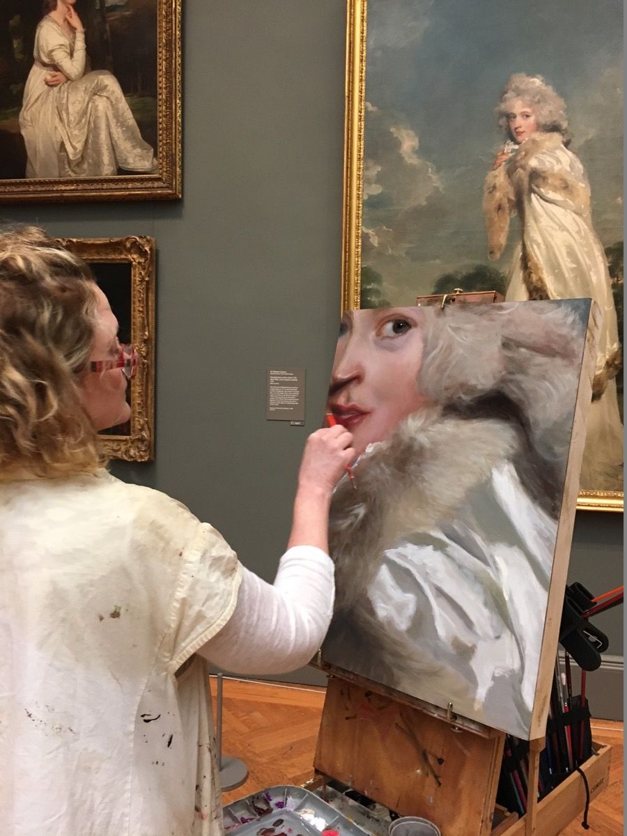 Artist painting in the Met
